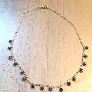 Silver necklace with blackish-purple beads